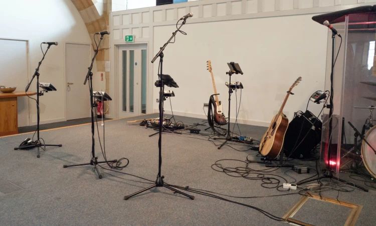 Microphone Stands With Guitars In Music Room